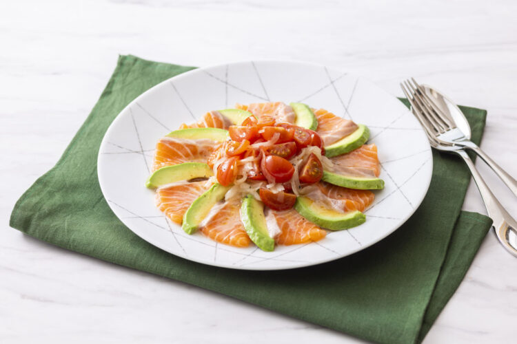 Salmon and avocado carpaccio with marinated small tomatoes